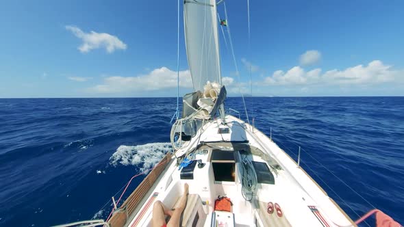 Firstperson View of Yacht's Prow in the Blue Sea Water