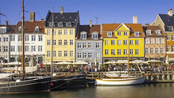 Copenhagen, Denmark, Timelapse - People walking at the Nyhavn Waterfront canal