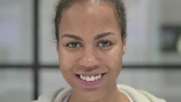 Face of African Woman Smiling at the Camera