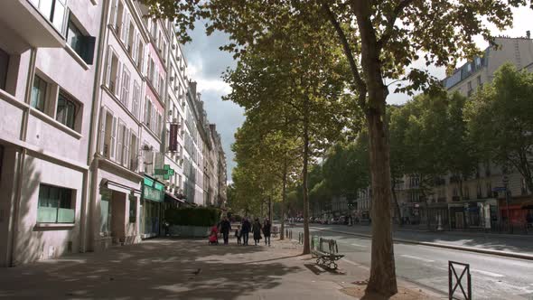 Timelapse of walking in Parisian street on sunny autumn day