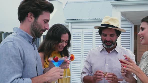 People holding cocktails