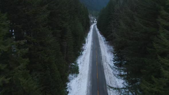 Aerial View From Above of Road By Fresh Water Flowing Down a River Creek