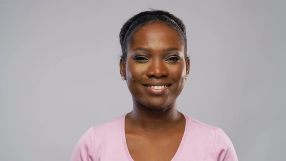 Happy African American Woman Over Grey Background