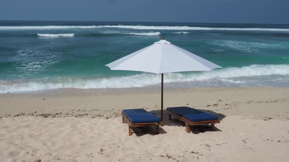 Beach Chair and Umbrella on Tropical Sand Beach