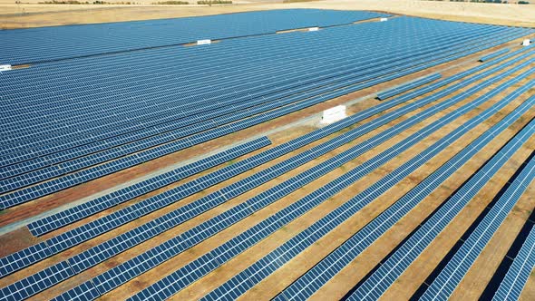 Drone Shot of a Large Solar Park Located in a Field