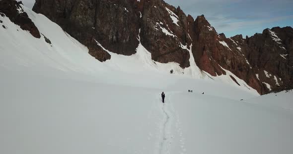 A Large Group of Climbers Climb To the Top