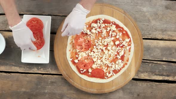 Chef Making Caprese Pizza.