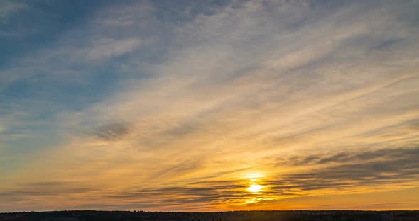 Beautiful Evening Sunset Time Lapse Movement of Clouds of a Different Level Against the Setting Sun