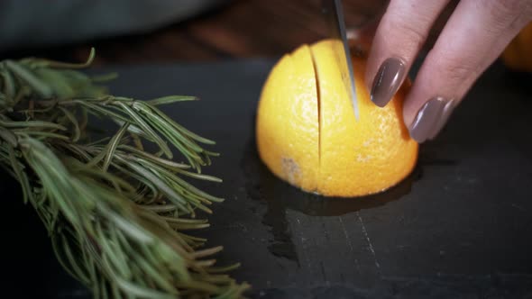 Slicing a Lemon on a Slate Board