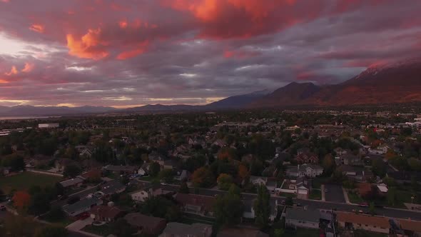 Flying over city at sunset