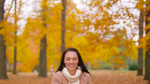 Happy Woman Having Fun with Leaves in Autumn Park 15