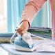 Female Hands Ironing Clothes with Iron on Ironing Board - VideoHive Item for Sale