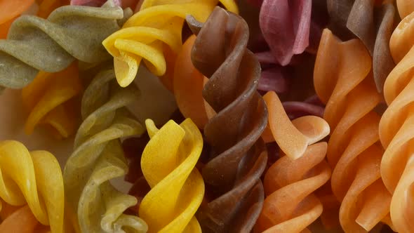 Colored italian fusilli raw pasta