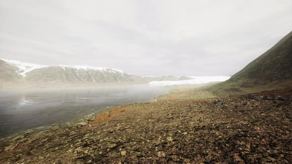 Snowy Mountains and Drifting Icebergs in the Greenland Sea