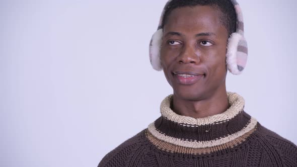 Face of Young Happy African Man Thinking Ready for Winter
