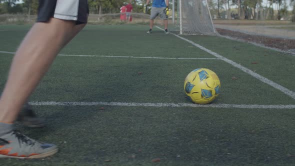 Football Player Kicking Ball on Corner Kick