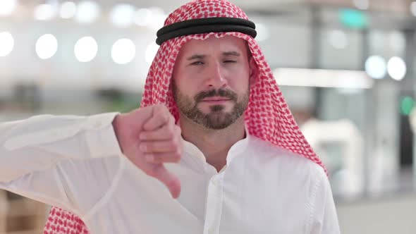 Disappointed Arab Businessman Doing Thumbs Down