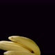 Flying Bunch of Bananas on a Black Background - VideoHive Item for Sale