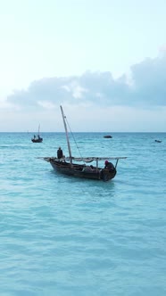 Vertical Video Boats in the Ocean Near the Coast of Zanzibar Tanzania