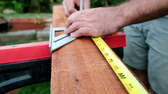 Carpenter Prepares Wood for Woodworking Project, Slow Motion of Hands Making Measurements on Wood Pl