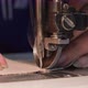 Manufacturing shoes in a shoe factory. Sewing shoes from natural leather (close-up) - VideoHive Item for Sale