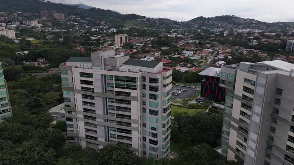 Aerial shot of a high rise building and skyscrapers in the city of San Jose