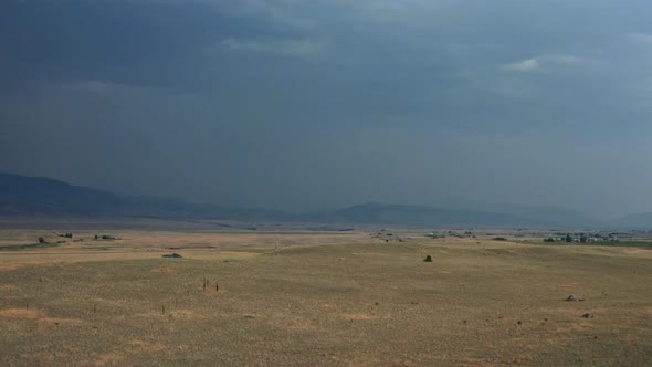 An rearwarding aerial shot of the Paradise Valley of the Yellowstone River in southwestern Montana.