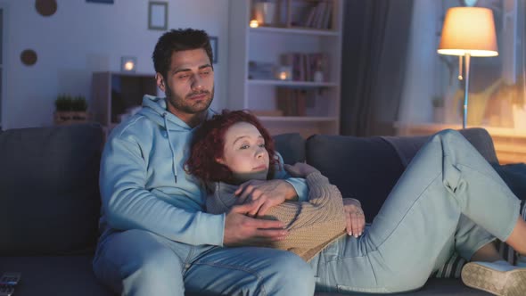 Couple Watching TV in Evening