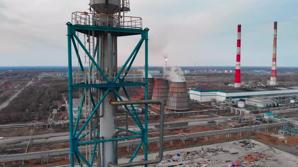 The Drone Climbs Up the Flare Stack Which Burns Excess Gas