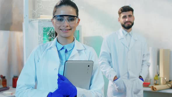 Charismatic Woman and Man Scientist Happy Posing