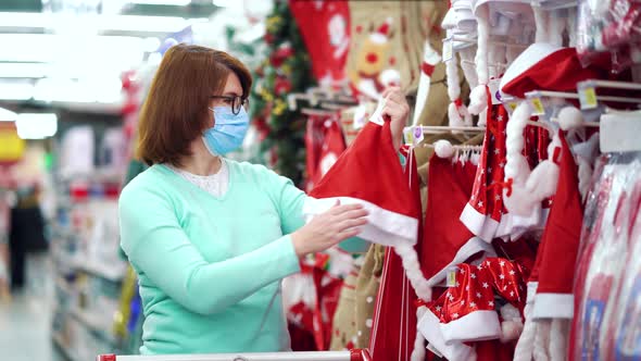 Woman buying funny hat for Christmas during pandemic