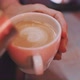 Barista pouring milk into a coffe cup, creating flower pattern - VideoHive Item for Sale