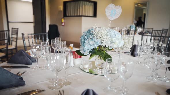 Elegant center piece on a banquet hall table during a wedding.