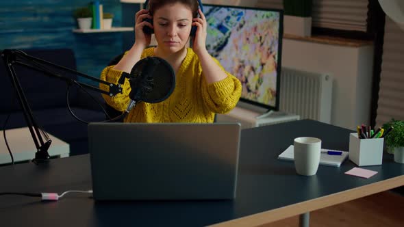 Creative Influencer with Headphones Preparing to Speak with Fans