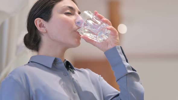 Portrait of Young Indian Woman Drinking Water