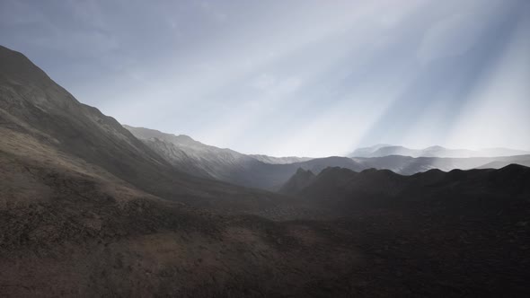 Sun Rays Against the Backdrop of the Mountains