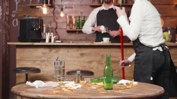 Restaurant Staff Cleaning After All Customers Have Left