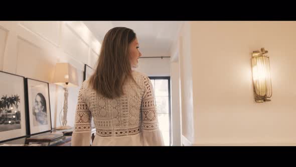 Woman walking In A Beach House