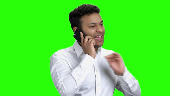 Young Expressive Businessman Talking on Phone