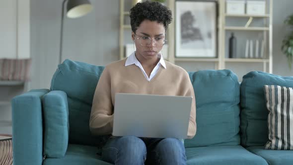 Young African Girl Having Neck Pain While Working