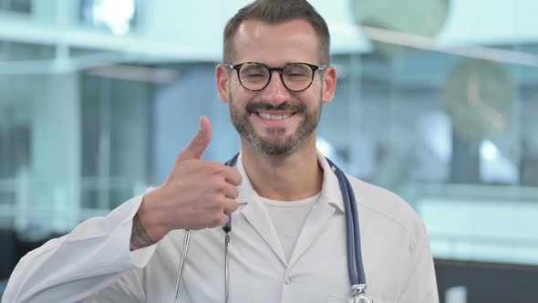 Middle Aged Male Doctor Showing Thumbs Up Sign