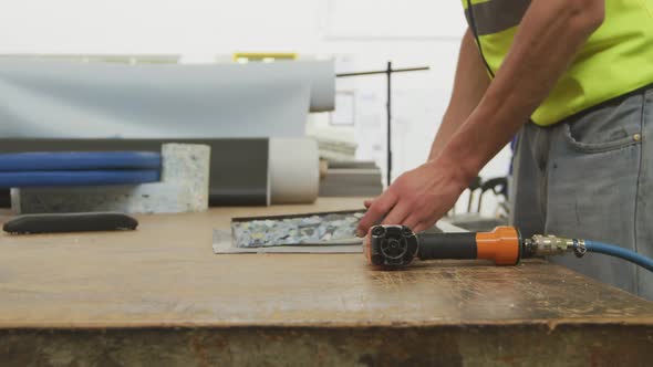 Workers assembling two objects