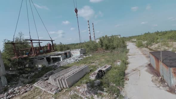 FPV Drone Flies Quickly and Maneuverable Among Abandoned Industrial Buildings and Around an