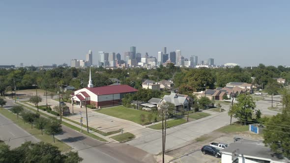 Aerial view over neighborhood near downtown Houston. This video was filmed in 4k for best image qual