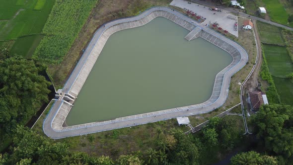 Aerial view of "Embung Imogiri" a pond with a puppet-like shape in the Bantul area, Yogyakarta