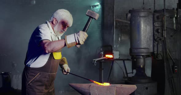 Blacksmith Red Hook with Hammer Beating