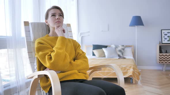 Thinking Middle Aged Woman Sitting on Casual Chair, Brainstorming