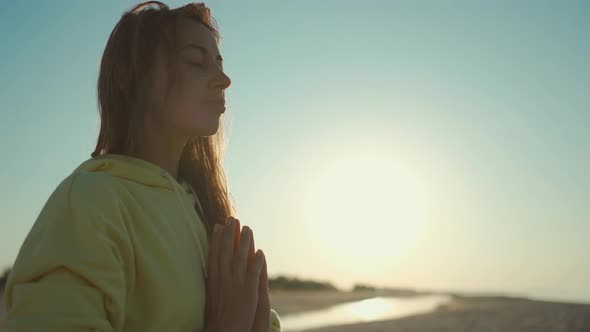 Camera Moving Around Young Relaxed Woman Practices Proper Breathing and Yoga Meditation Practicing