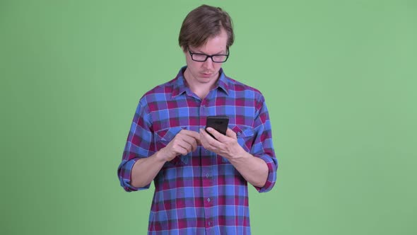 Young Handsome Hipster Man Using Phone