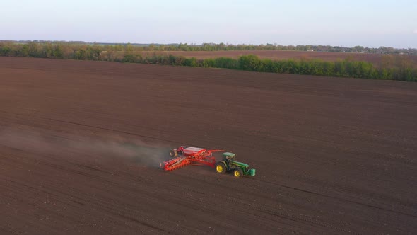 Working At The Field Tractor With The Seeder 3